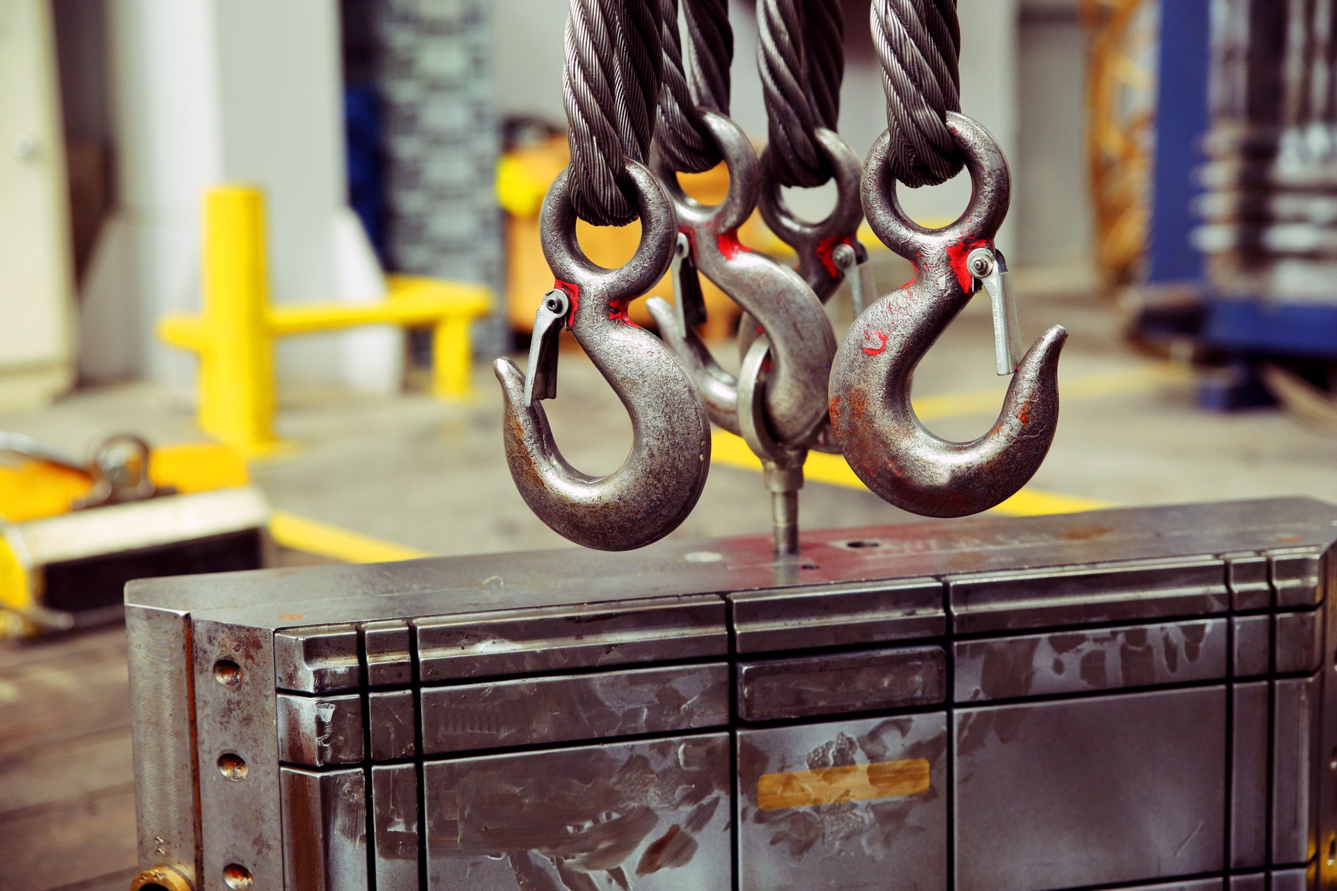 Chain hook of overhead crane and mold on floor factory